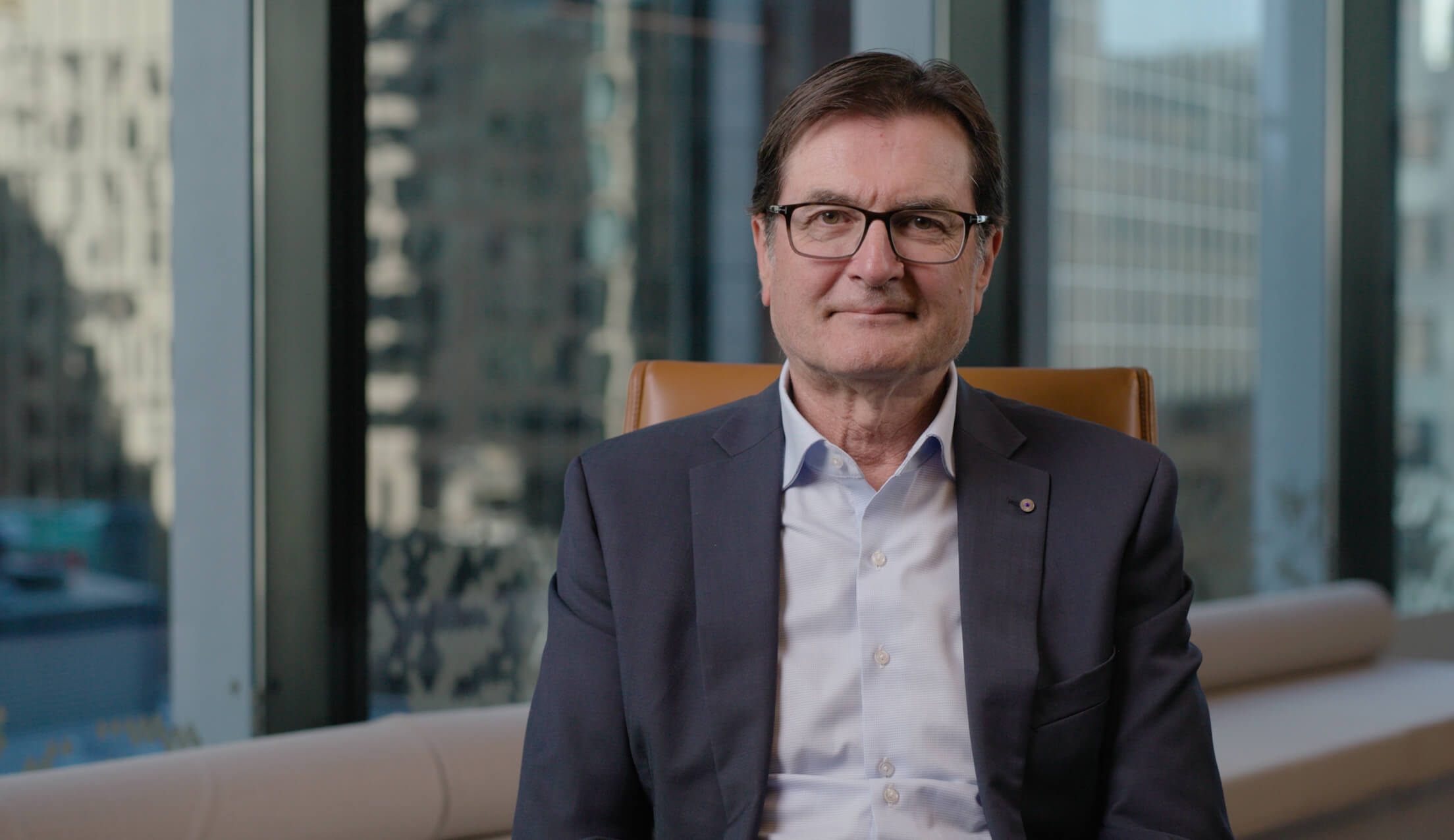 Greg Combet sitting down and facing the camera.